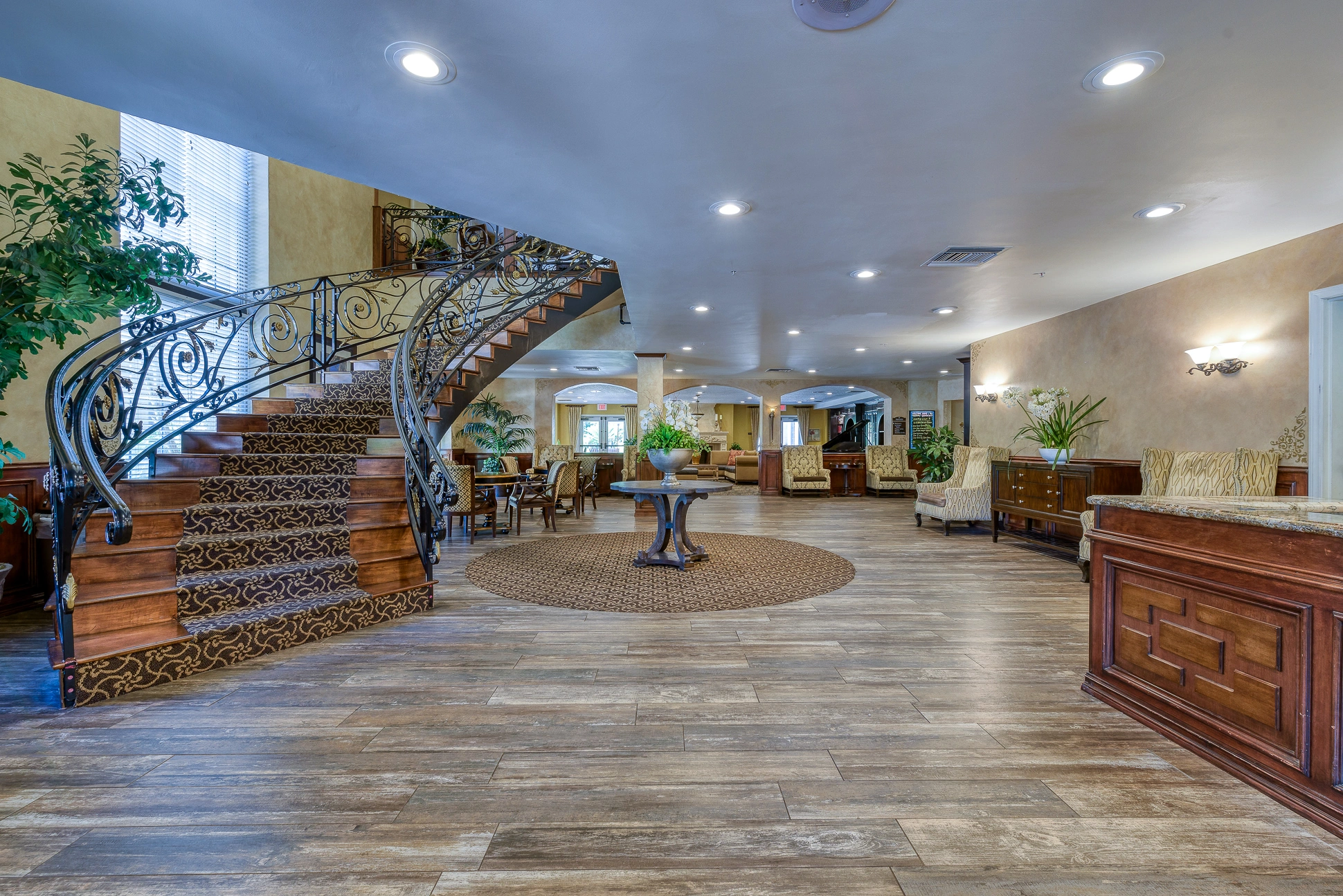 spacious lobby with staircase and concierge